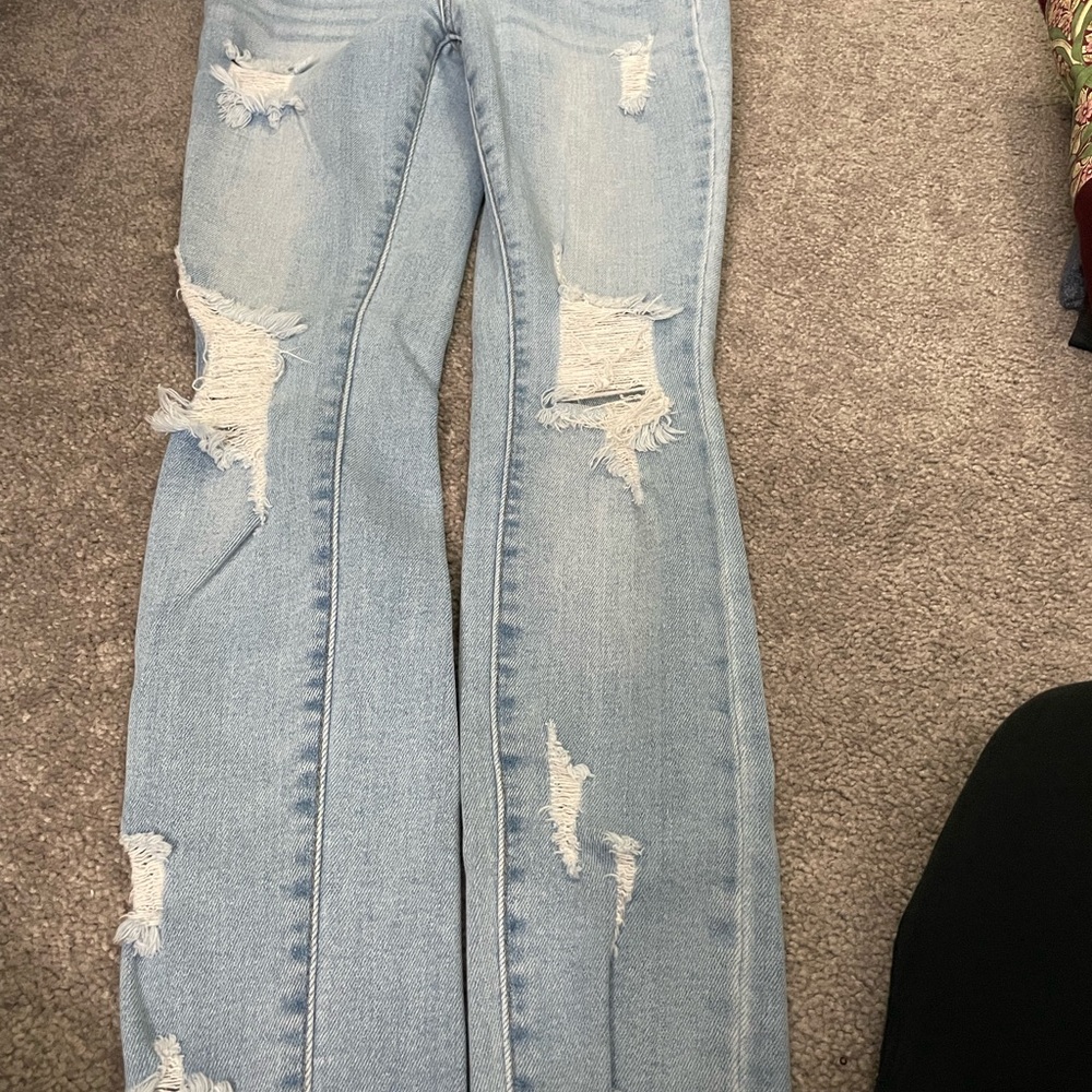 Light blue ripped jeans